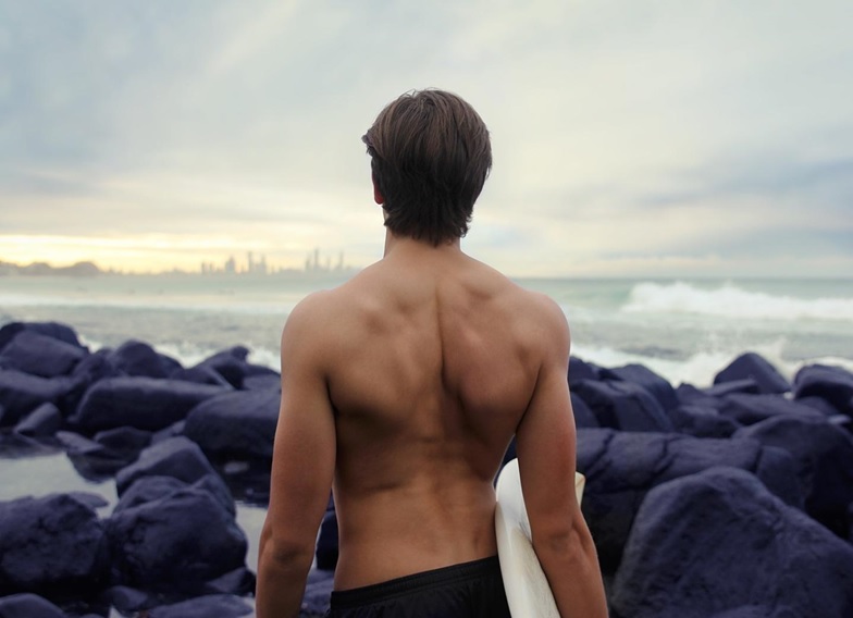 A man holding a surfboard